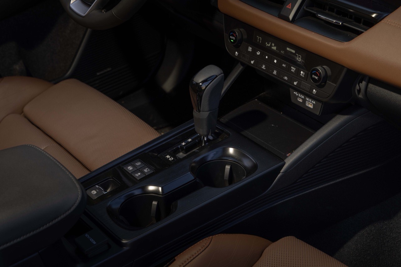 The Subaru Outback center console, showing the gear selector, cupholders and climate controls
