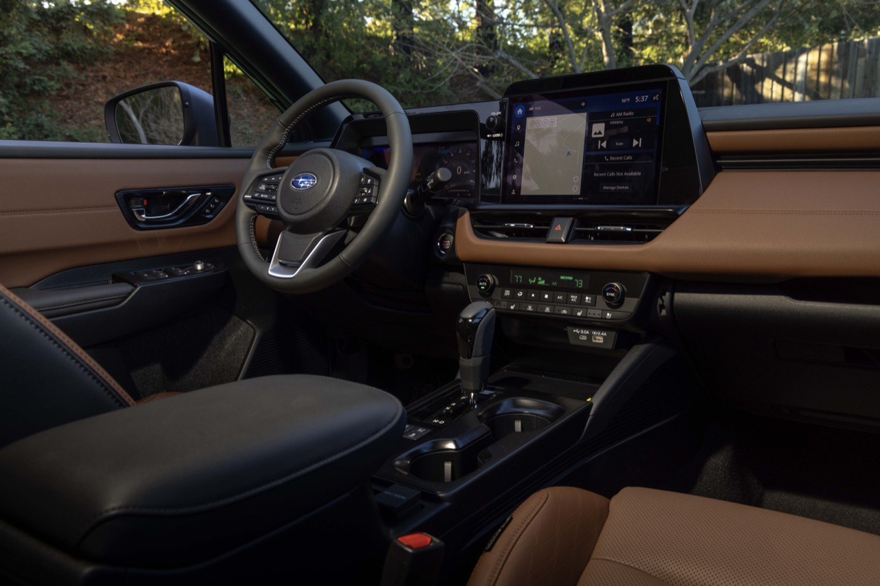 The Subaru Outback cabin seen from the passenger side, showing the steering wheel, touchscreen and console