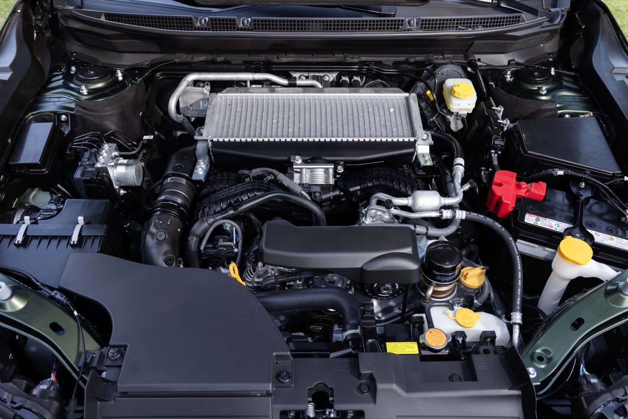 The Subaru Outback engine bay with the hood open, showing the BOXER engine and the intercooler mounted on top